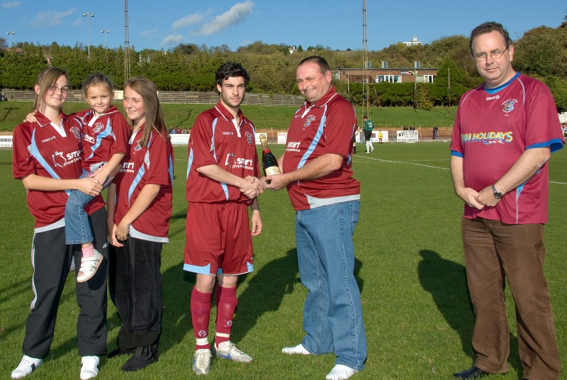 Frankie was also Man of the Match. Here he is receiving his bubbly from Roy Trunchion, one of his kit sponsors, watched by Layla, Bryony, Lucy and supporters club chairman Pat McCrossan
