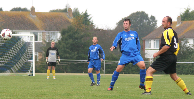 Brett Neal gets the ball away
