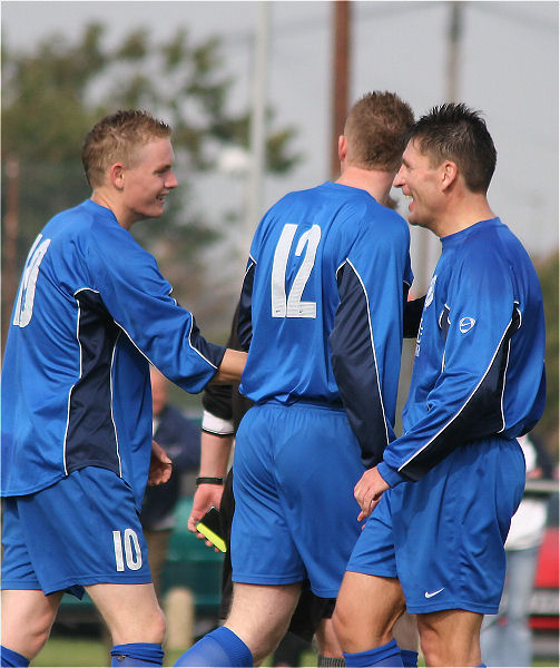 James Highton is congratulated on his hat-trick by Andy Smart (12) and Terry Withers
