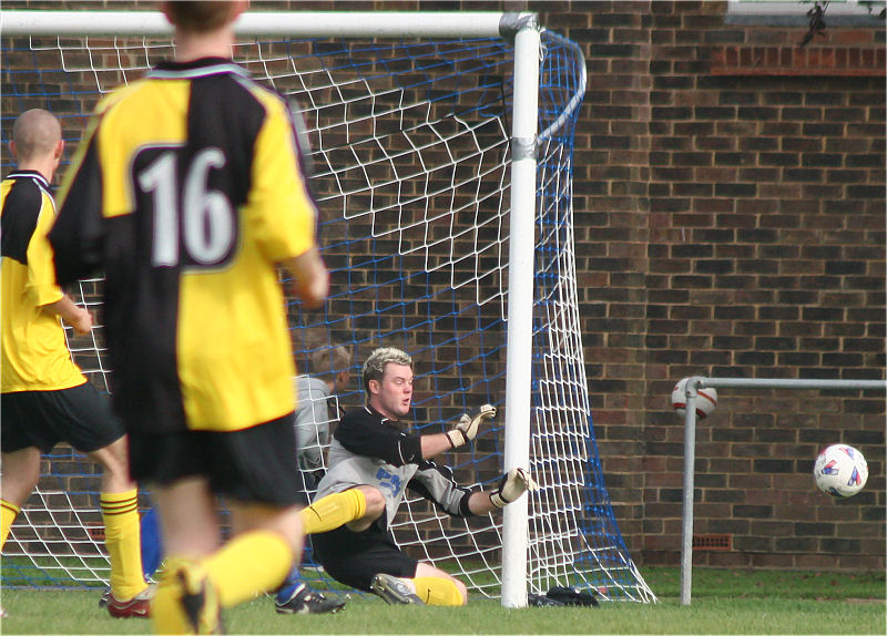 Andy McCarthy makes a save by the post
