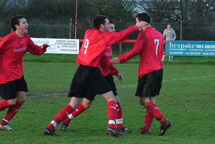The Tom Manton (7) fan club, Marc Cooper, Chris Morrow (9) and Adam Hunt after the first goal
