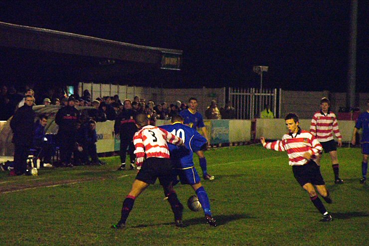 Leon McDowall (10) closely watched by K's Bashiry Alimi
