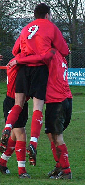 Chris Morrow (9) and Adam Hunt celebrate Tom Manton's first goal
