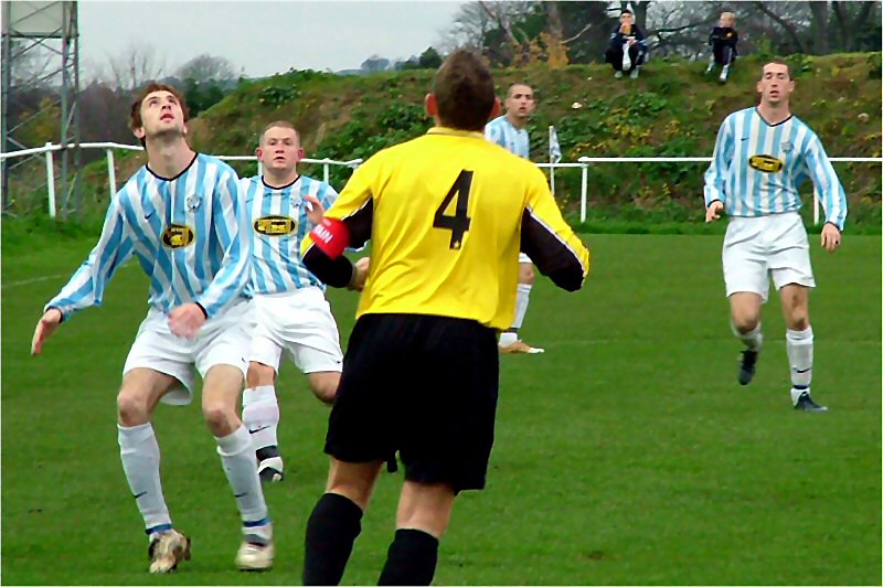 Littlehampton captain Gary Young (4) and Worthing United's  "Biff" Shelley 
