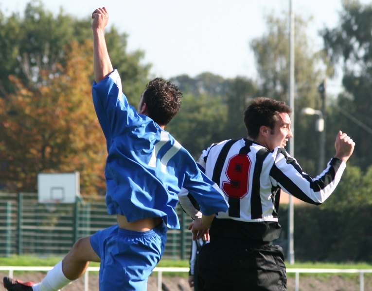 David Cooke (11) and Phil Gault (9) go for a header
