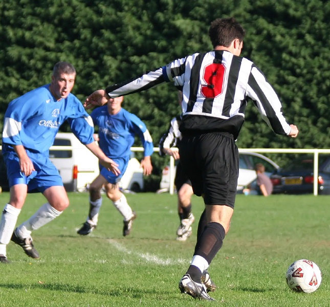 St Francis Rangers captain Phil Gault crosses the ball
