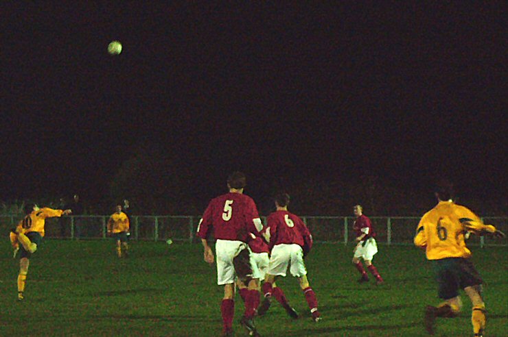 Horsham's Andy Walker heads away from Paul Jones (6) and Barry Pidgeon (5) wth Ryan Rummery (6) waiting in the area
