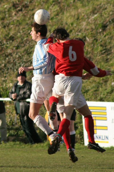 Kevin Bush (6) and Worthing United's Steve Webb
