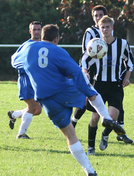 Dan White hooks the ball away
