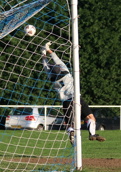 Simon Lehkyj makes a good save to beat out this dipping shot
