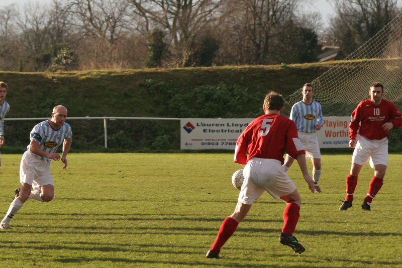 Barry Pidgeon on the ball about to be challenged by Steve Pickles
