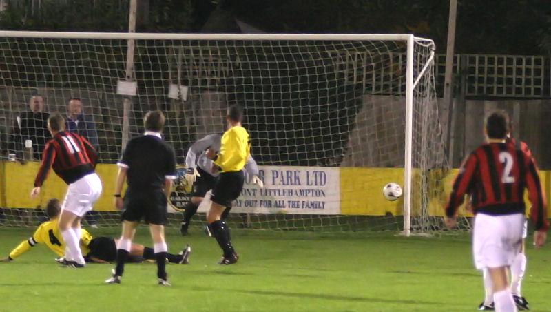 This effort by Danny Curd is put out for a corner by Gary Young
