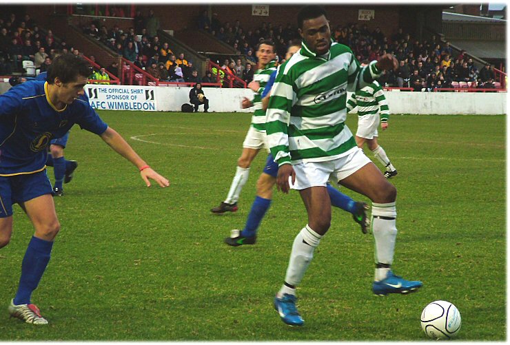 Paul Scott on the ball with Steve Gibson tracking and Lee Sidwell close by
