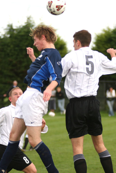 Ross Treleaven jumps for a header with Chris Hall (5)
