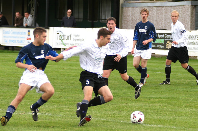 Chris Hall (5) gets the ball away 
