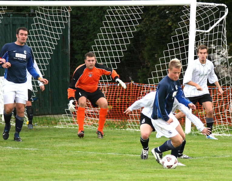 Dean Chamberlain closely marked by Stuart Bennett with Craig Bishop, Darren Prior and Ryan Dick watching

