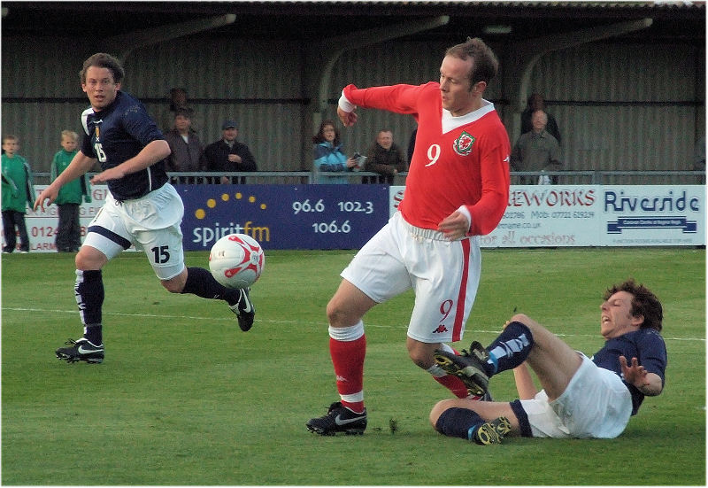 Graham Evans (9) breaks through the Scottish defence to score the 1st goal for Wales
