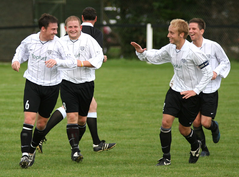 ... and Stuart is congratulated by Paul Brown, Dave Hall and Matt Axell
