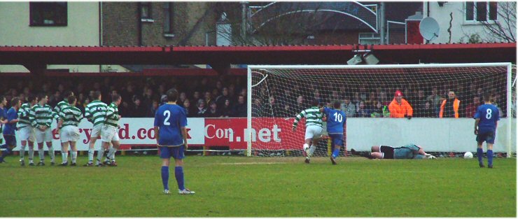 James Wastell makes a great save from a brilliant Rob Ursell free kick
