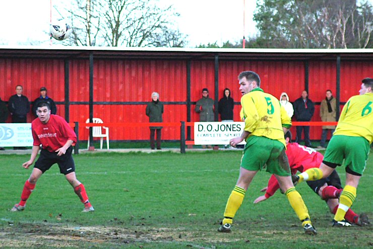 Marc Cooper beats Jamie Podmore (5) and Carl Morris (6) to flick this one just wide with Hassan Yassan looking on
