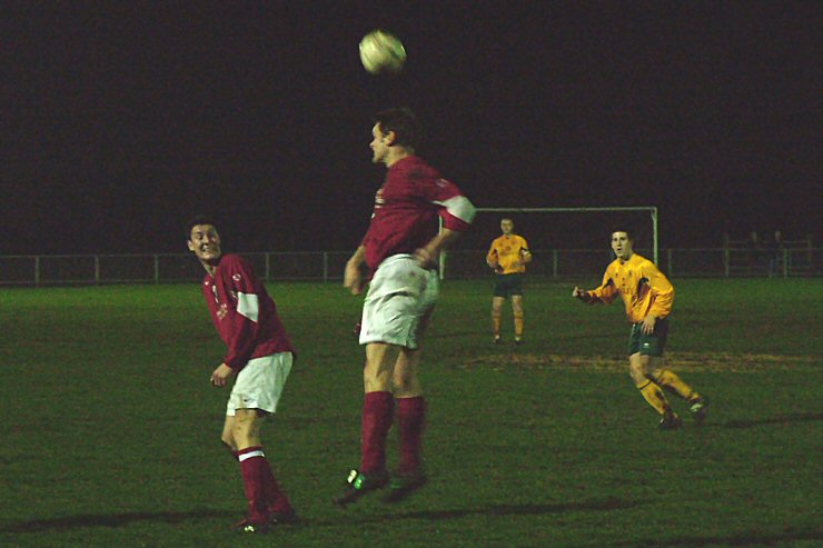 Barry Pidgeon heads away watched by Josh Sutcliffe
