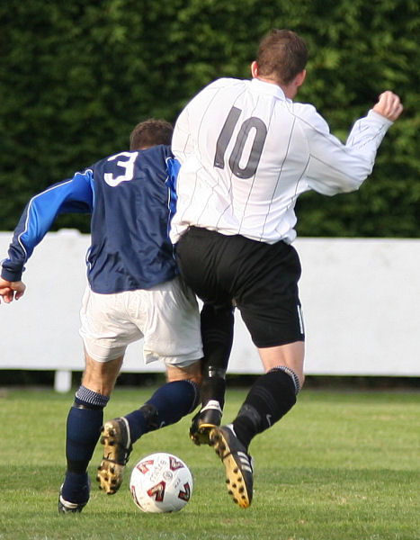 James Bennett (10) tackles Steve Prodger (3)
