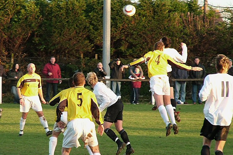 Gary Young (4) challenges EP's Chris Hibberd
