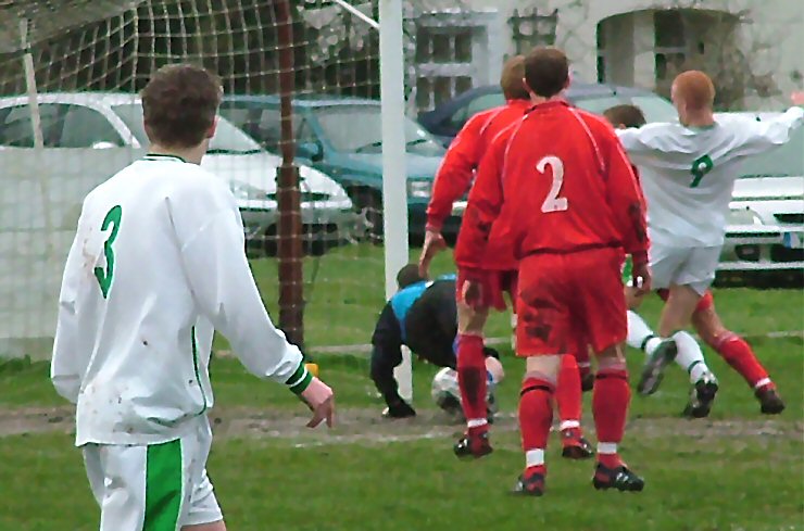 Scott Tipper (9) squeezes the ball home for the first goal
