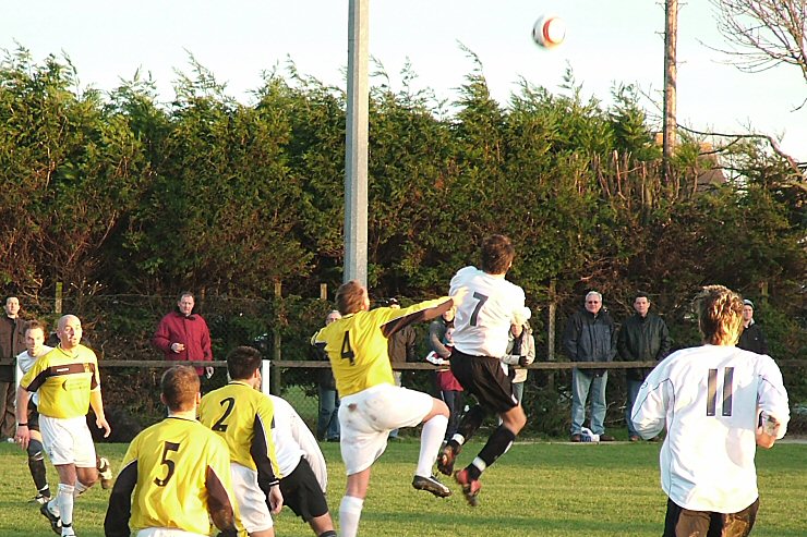 Gary Young (4) and Chris Hibberd (7) climb for the ball
