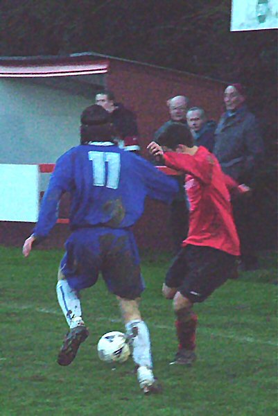 Tom Manton turns on the ball and is challenged by Ben Boiling
