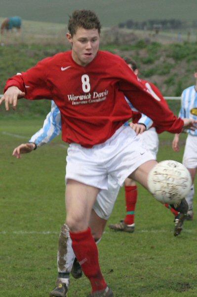 Arundel's Lloyd Walker brings the ball down
