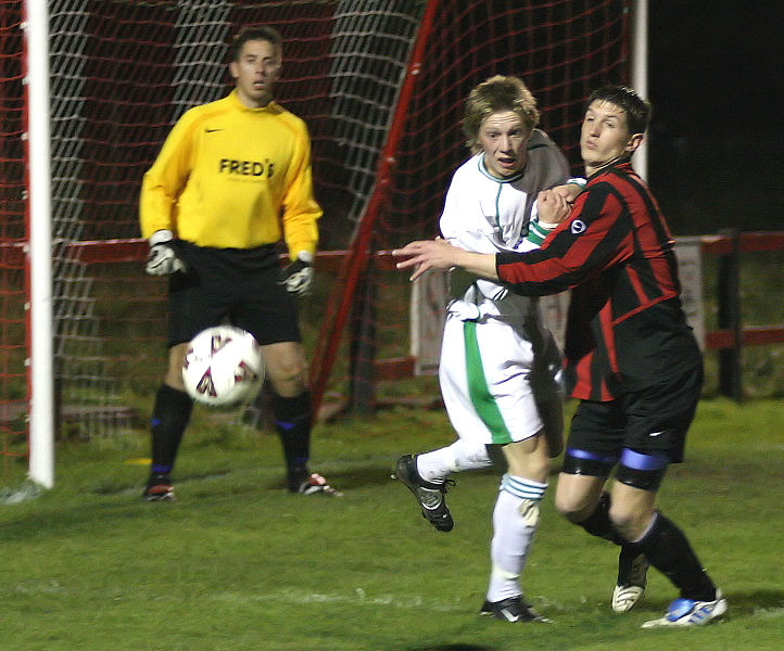 Simon Davey watches as Adrian Brockway and Adam Burton clash
