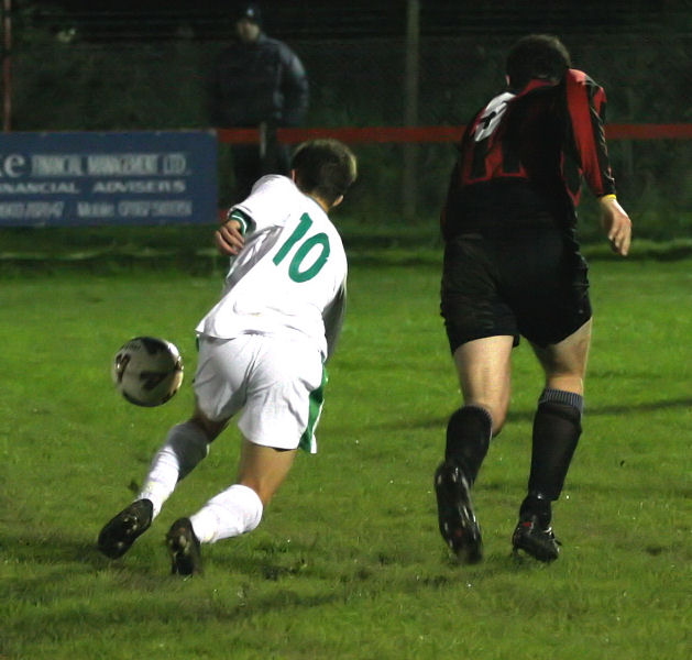 Scott Murfin (10) goes past Pete Christodoulou
