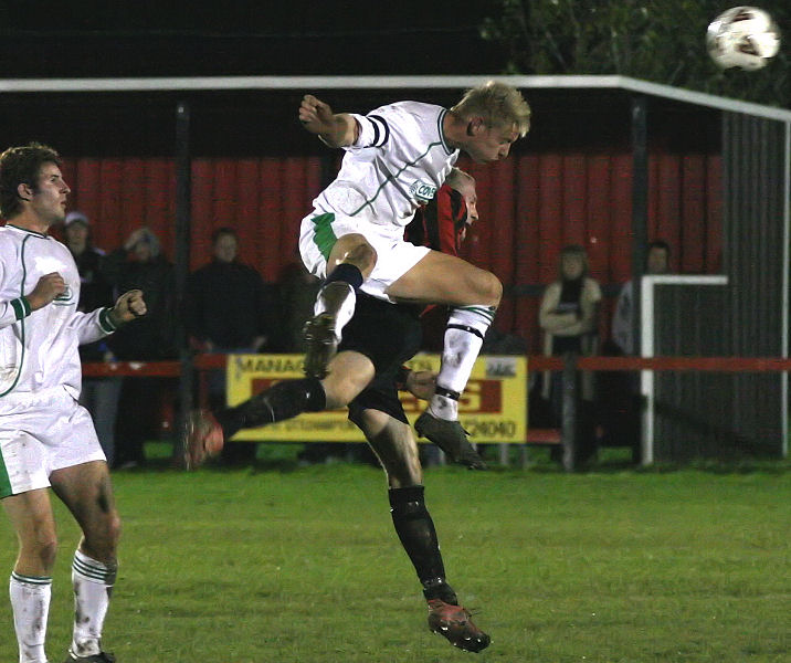 Alex Ward gets high above Kane Evans for this header
