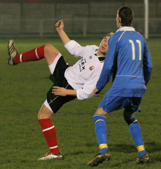 Jordan Willis hooks the ball back over Grant Philpott into the goalmouth
