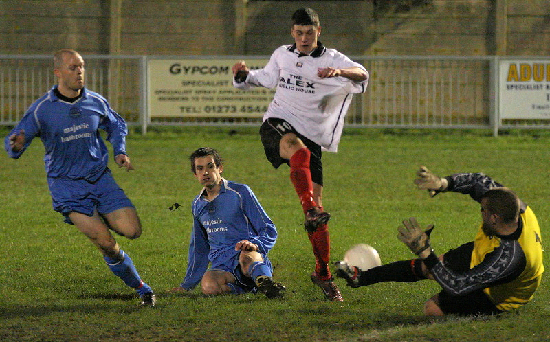 Darren Prior saves at the feet of Michael Frangou
