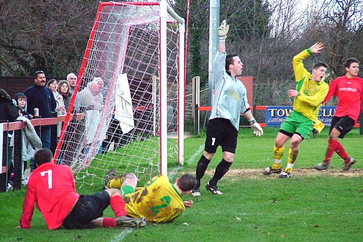 Tom Manton (7) wins a corner for Wick from a challenge by Mark Drinkwater despite appeals by Westfield
