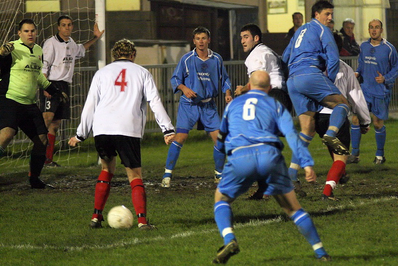 Goalmouth scramble and James Heller has the ball
