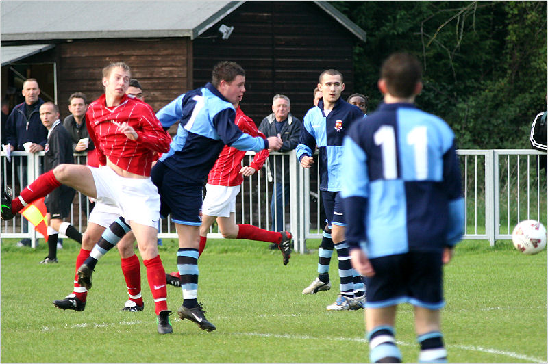 Mike Huckett wins an early header
