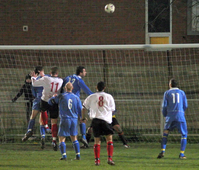 Action in the Shoreham goalmouth
