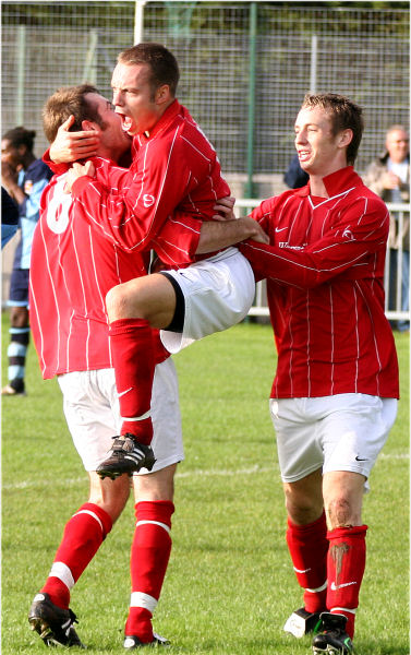 ... and Matt celebrates with Andy Boxall, brother Mike joins in too
