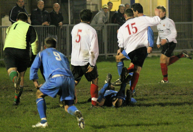 Richard Carter (behind Mark Livermore 15) puts Shoreham 3-2 up on 85 minutes ...
