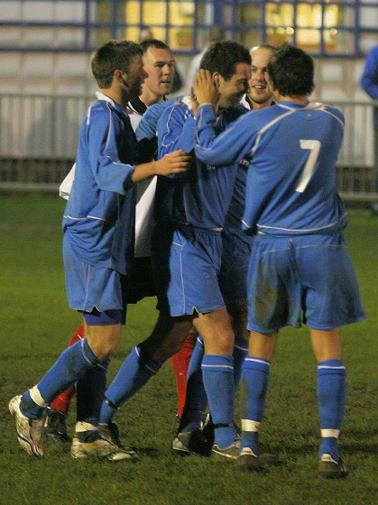 ... and he is greeted by Owen Callaghan, Darren Annis and Chris Hibberd
