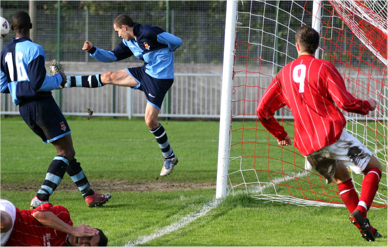 ... and the Croydon defence clear the ball away as Jason feels the effect of the keeper's glove
