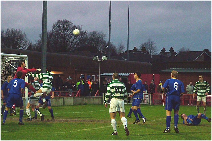 Danny Naisbitt punches this corner away under pressure only to be beaten by Paul Scott's return shot
