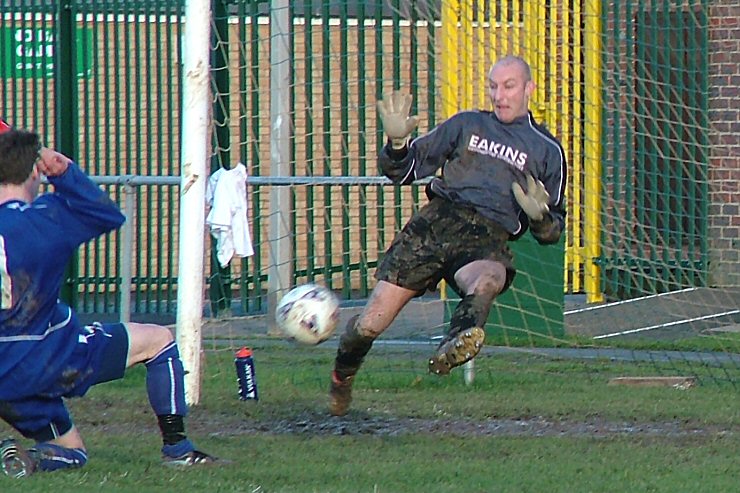 Gary Newman saves this close shot from Ryan Morten
