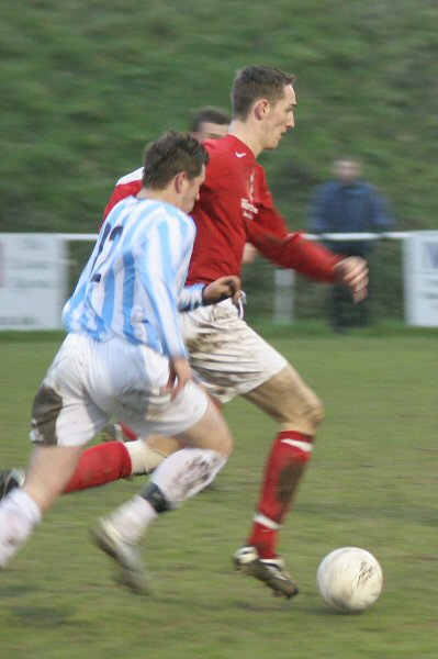Arundel's Paul Jones about to be tackled by Simon Gordon
