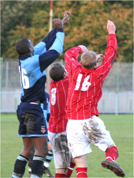 Mark Hall (16), Andy Boxall (8) and Rob Grove (16) look for the ball
