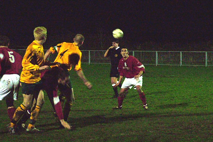 The ball falls to Jason Wimbleton but the ref has blown for a free kick for a foul by Paul Jones on Horsham captainEddie French
