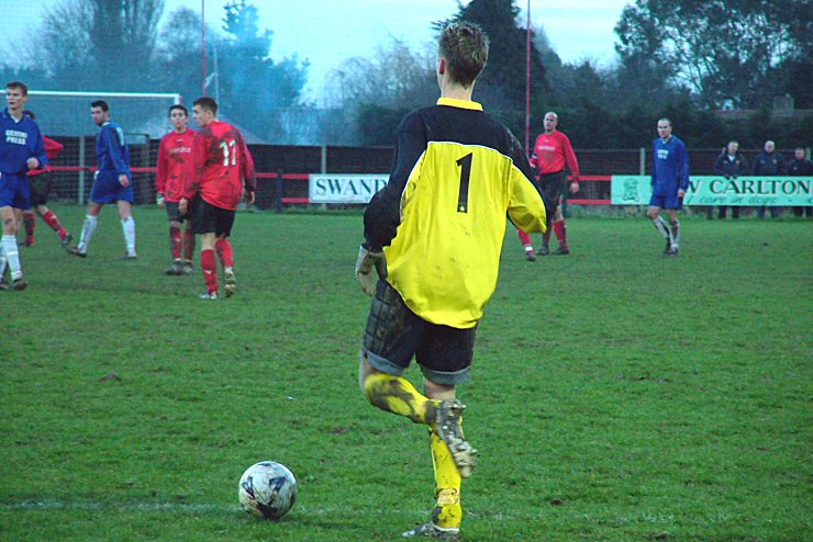 Adam Laundon about to clear the ball
